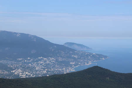 Beautiful sea landscape. Mountain flowing into the sea on the horizon. The views from the height of...