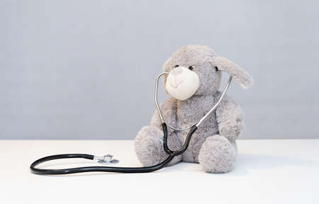 Teddy Bear with stethoscope Health Care teddy bear on background and stethoscopeの写真素材