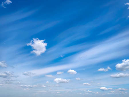 Summer background of the blue sky with clouds