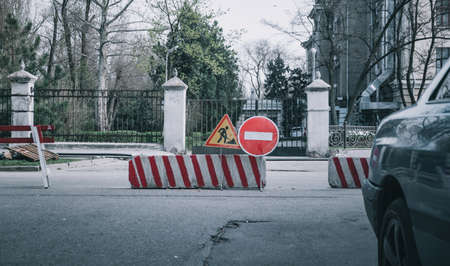 no entry sign on the road. traffic sign no entry. barrier at the road . closed area with roadblockの写真素材