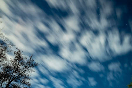 sky with stars and motion of clouds. cloudscape of night stars