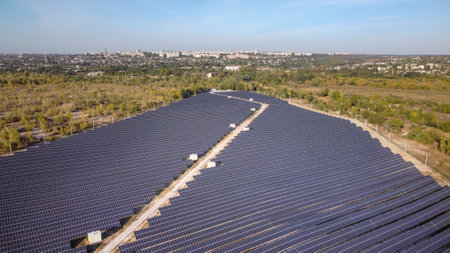 Solar energy farm. High angle, elevated view of solar panels on an energy farm far from city. aerial...