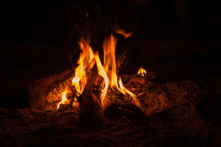 Campfire at tourist camp at nature. Flame on dark abstract background. Cookingの写真素材