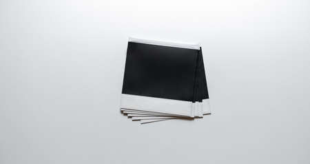 Pile of photo frames on white background. Empty photo frames on white backgroundの写真素材