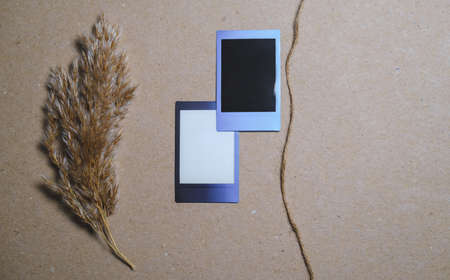 Two Vintage Photo Frames with reed and rope on brown wall. Perfect design elements, scrapbooks, memories, craft projectsの写真素材