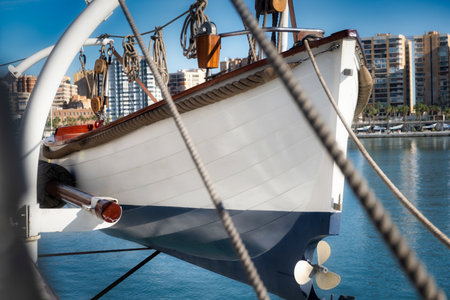 Lifeboat Ready for Rescue on Ship in Urban Portの写真素材