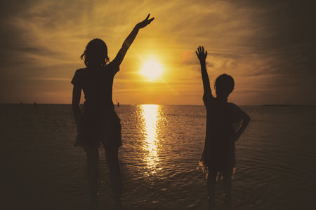 Two friends meeting waving hello. Happy young kids waving hand cheerfully. Concept of friendship,...