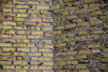 Brick wall of a simple cracked bricks