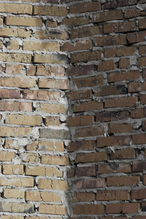 Brick wall that based on the brickwork of rough multicolored bricks.