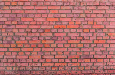 Background color brick, made on the basis of the wall of rough masonry (brickwork).