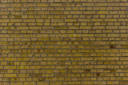 Multi colored brickwork background based of the wall of rough brickwork (masonry).