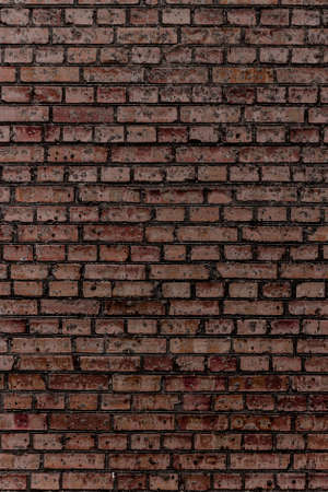 Multi colored brickwork background based of the wall of rough brickwork (masonry).の写真素材