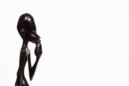 African woodcarving depicting a man with an ideaの写真素材
