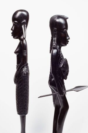 African woodcarvings of a woman and a warrior fightingの写真素材