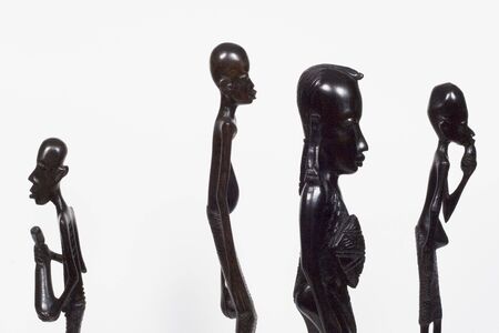African woodcarvings showing one who dares to be different from the restの写真素材