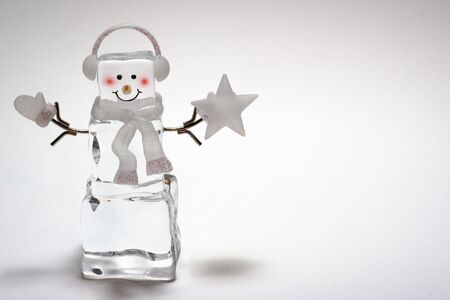 Ice cube snowman with star and mittenの写真素材