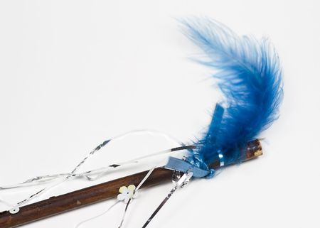 Homemade magic wand with blue featherの写真素材