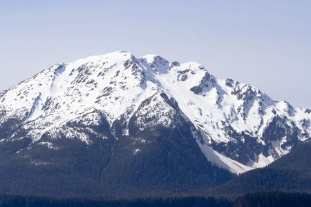 Snow covered mountain peaks near Juneau, Alaska taken from sea.の写真素材