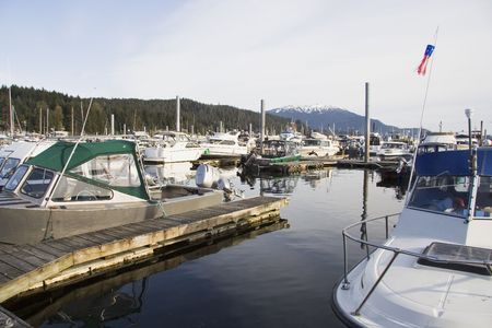 Boats docked with mountains in the background in Skagway Alaska