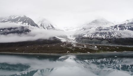 Beautiful snowcapped mountains and water in Glacier Bay National Park Alaskaの写真素材
