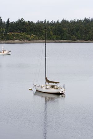 Sailboat anchored in harbor at Spencer Landing Marina on Lopez Island in Washington
