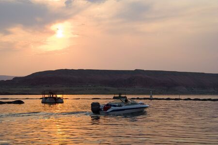 Sunset at Lake Powell water and desert area in Glen Canyon National Recreation Area Utahの写真素材