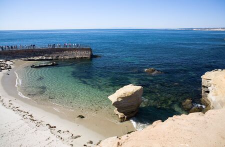 Beautiful cliffs, rocks, beach, and Pacific Ocean in La Jolla California in the late eveningの写真素材