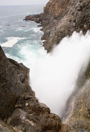 The La Bufadora Blowhole in Ensenada, Baja California, Mexico that sprays water up to 70 feet into the air.の写真素材