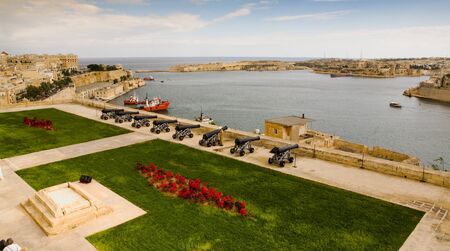 Cannons guarding the port of Valletta in the European country of Malta along the Mediterranean