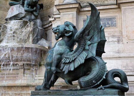 fountain; France; Paris; water; La Fontaine Saint-Michel; Saint Michaels Fountain; statue; water; landmark; beast; lion; wingedの写真素材