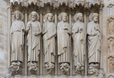 Sculptures on the side of the entrance to Notre Dame in Paris, France.
