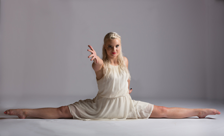 Two young ballroom dancers in studio taken against a high-key white backgroundの写真素材