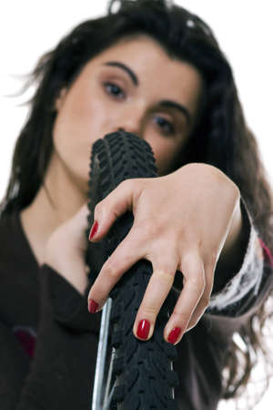 girl and bicycle wheel. photo shooting with make-upの写真素材