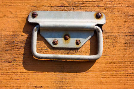 Handle screw to wooden surfaceの写真素材