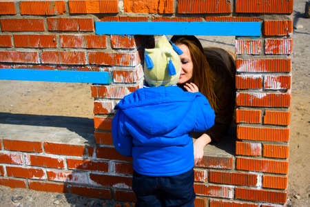 Mother and child on the playgroundの写真素材
