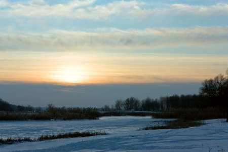 Winter sunset in countryside landscapeの写真素材