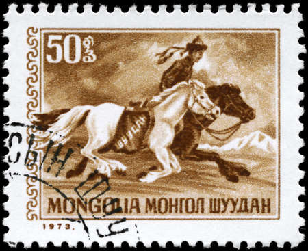 MONGOLIA - CIRCA 1973: A Stamp printed in MONGOLIA shows the Postrider, series, circa 1973の写真素材