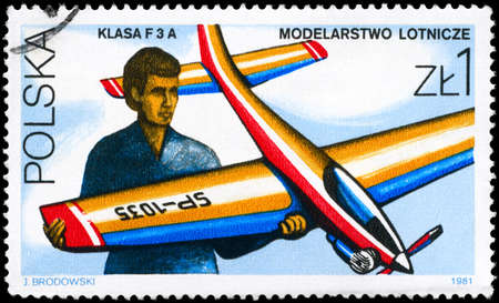 POLAND - CIRCA 1981: A Stamp printed in POLAND shows a man with model airplane,  series, circa 1981の写真素材