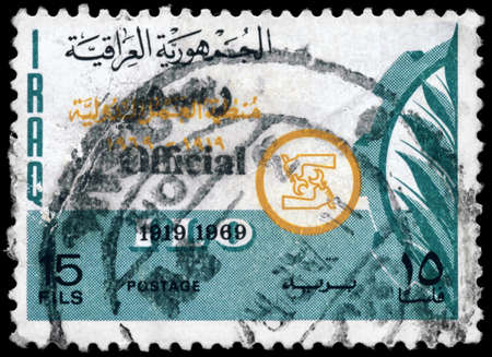 IRAQ - CIRCA 1969: A Stamp printed in IRAQ shows the ILO Emblem (50th anniv.), series, circa 1969