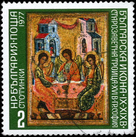 BULGARIA - CIRCA 1977: A Stamp printed in BULGARIA shows the Old Testament Trinity, Sofia, 16th Century from the series "Bulgarian icons.", circa 1977の写真素材