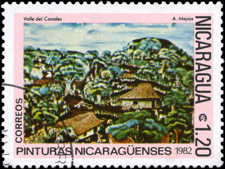 NICARAGUA - CIRCA 1982: A Stamp printed in NICARAGUA shows the painting "Canales Valley" of the artist A. Mejias, from the series "Paintings", circa 1982の写真素材