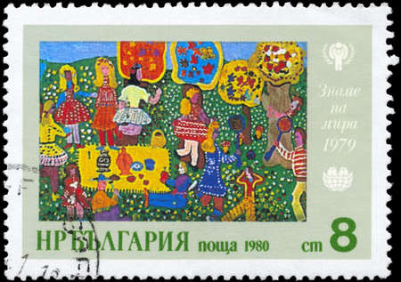 BULGARIA - CIRCA 1980: A Stamp printed in BULGARIA shows the Childrenï¿½s drawing and IYC emblem, from the series の写真素材