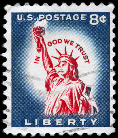 USA - CIRCA 1958: A Stamp printed in USA shows the Statue of Liberty, with the inscription In God we trust, circa 1958の写真素材