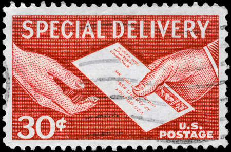 USA - CIRCA 1957: A Stamp printed in USA shows the Special Delivery Letter, Hand to Hand, series, circa 1957の写真素材