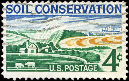 USA - CIRCA 1959: A Stamp printed in USA shows the Modern Farm, Soil Conservation Issue, circa 1959の写真素材