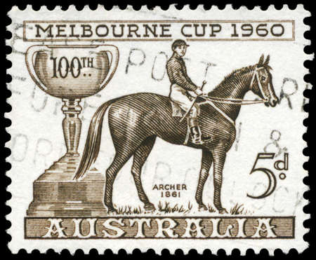 AUSTRALIA - CIRCA 1960: A Stamp printed in AUSTRALIA shows the Melbourne Cup and Archer, 1861 Winner, Centenary issue, circa 1960のeditorial素材
