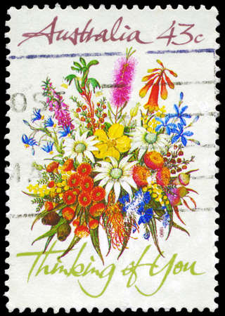 AUSTRALIA - CIRCA 1990: A Stamp printed in AUSTRALIA shows the Bunch of flowers with the description "Thinking of You", Special Occasions, circa 1990のeditorial素材