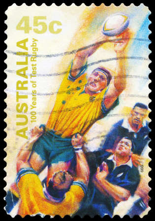 AUSTRALIA - CIRCA 1999: A Stamp printed in AUSTRALIA shows the Catching ball, 100 Years of Test Rugby, series, circa 1999のeditorial素材