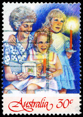AUSTRALIA - CIRCA 1987: A Stamp printed in AUSTRALIA shows the Grandmother and two Girls, Christmas series, circa 1987のeditorial素材