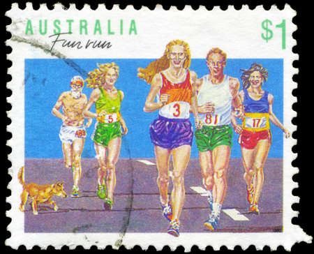 AUSTRALIA - CIRCA 1990: A Stamp printed in AUSTRALIA shows the Running, Sport series, circa 1990のeditorial素材